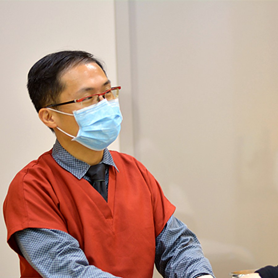 Dr Gerald Tan assessing a patient at Frances Medical & Aesthetic Clinic